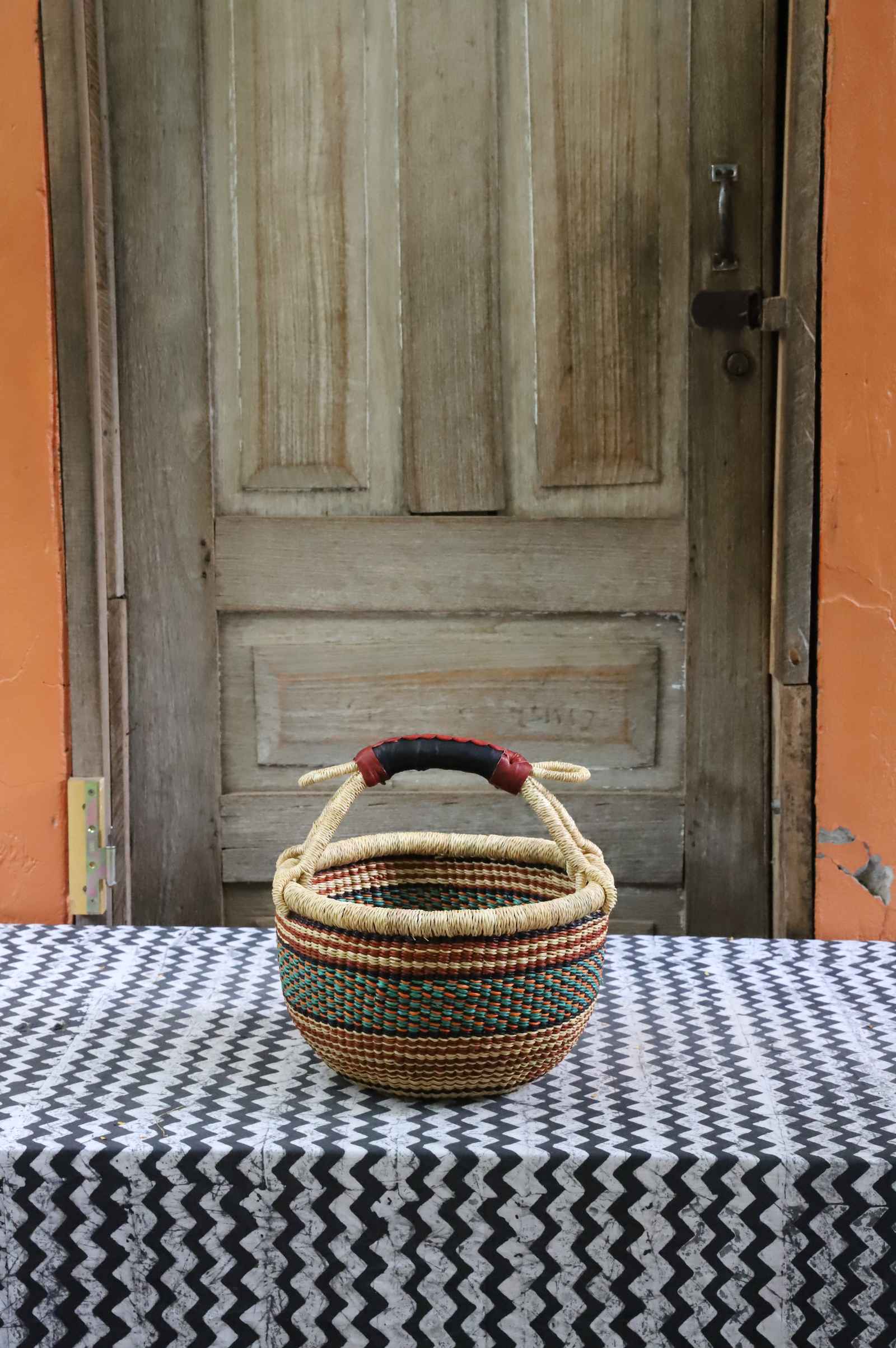 Small round shopping basket, a handwoven Bolga basket in tough elephant grass.