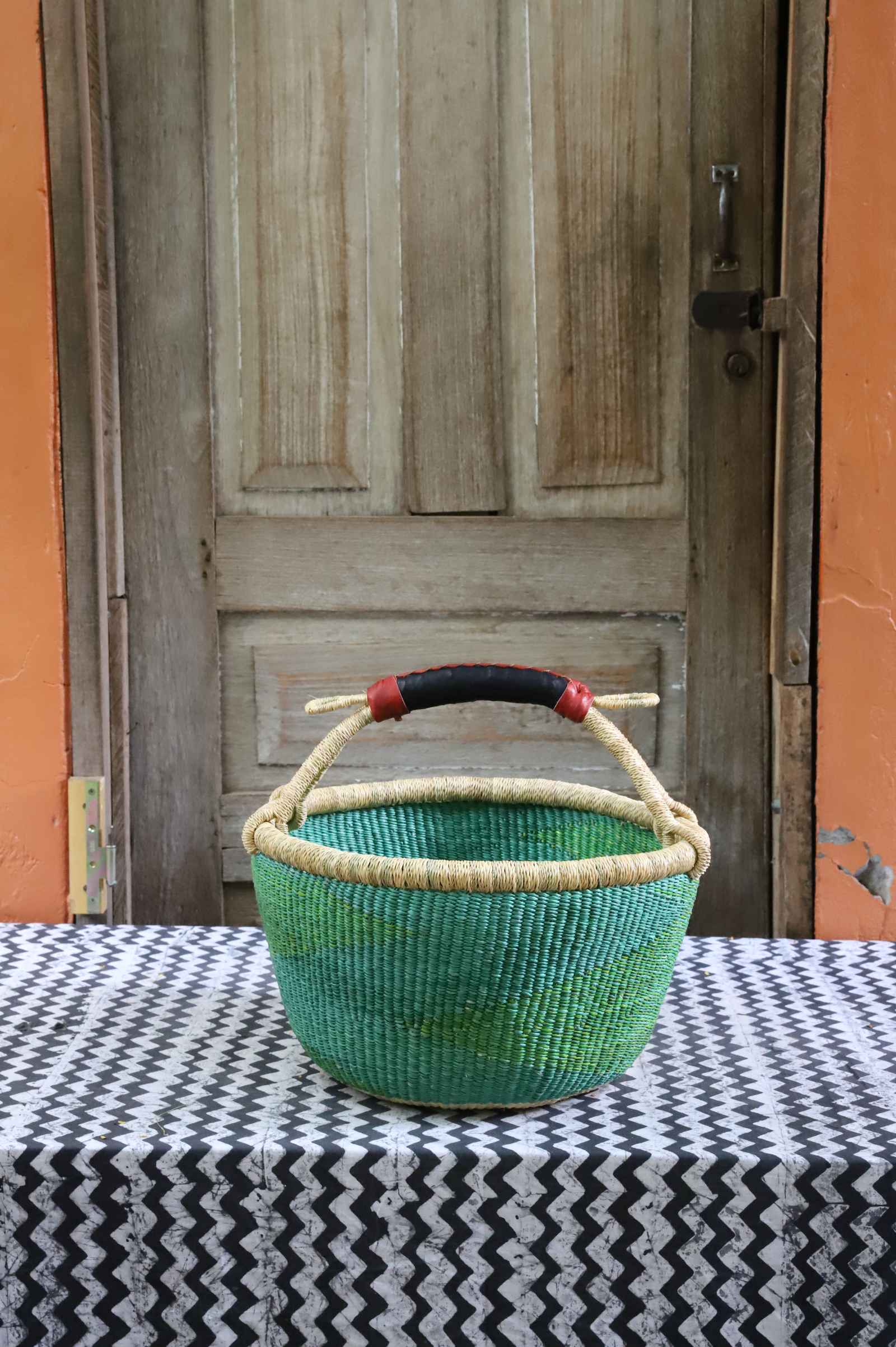 Round shopping basket, a handwoven Bolga basket in elephant grass from northern Ghana.