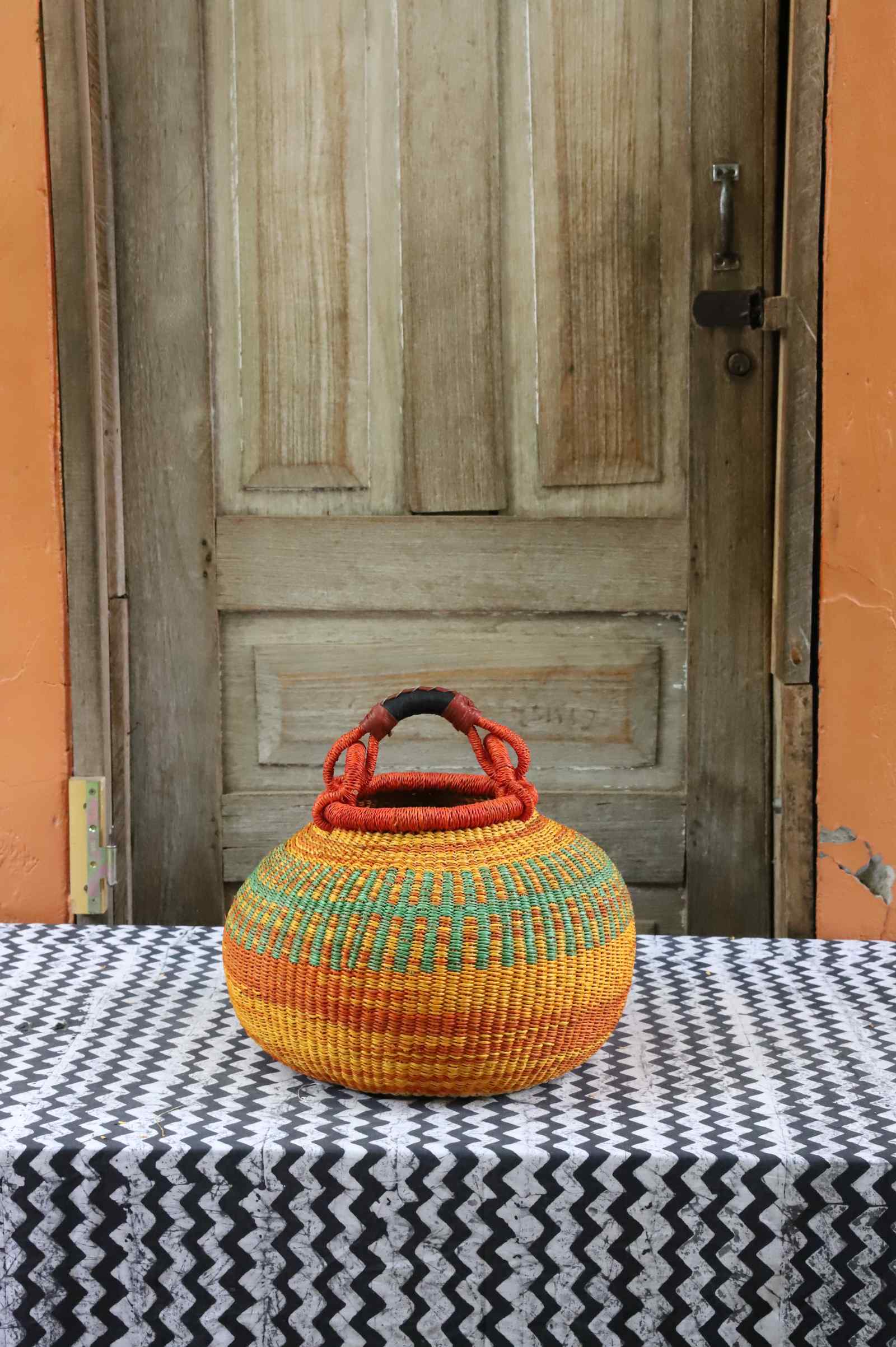 Medium pot storage basket, a handwoven Bolga basket in elephant grass, 38 cm wide.