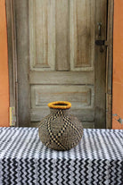 Jemima 10 Cows décor basket, a handwoven Bolga basket in elephant grass with a narrow opening.