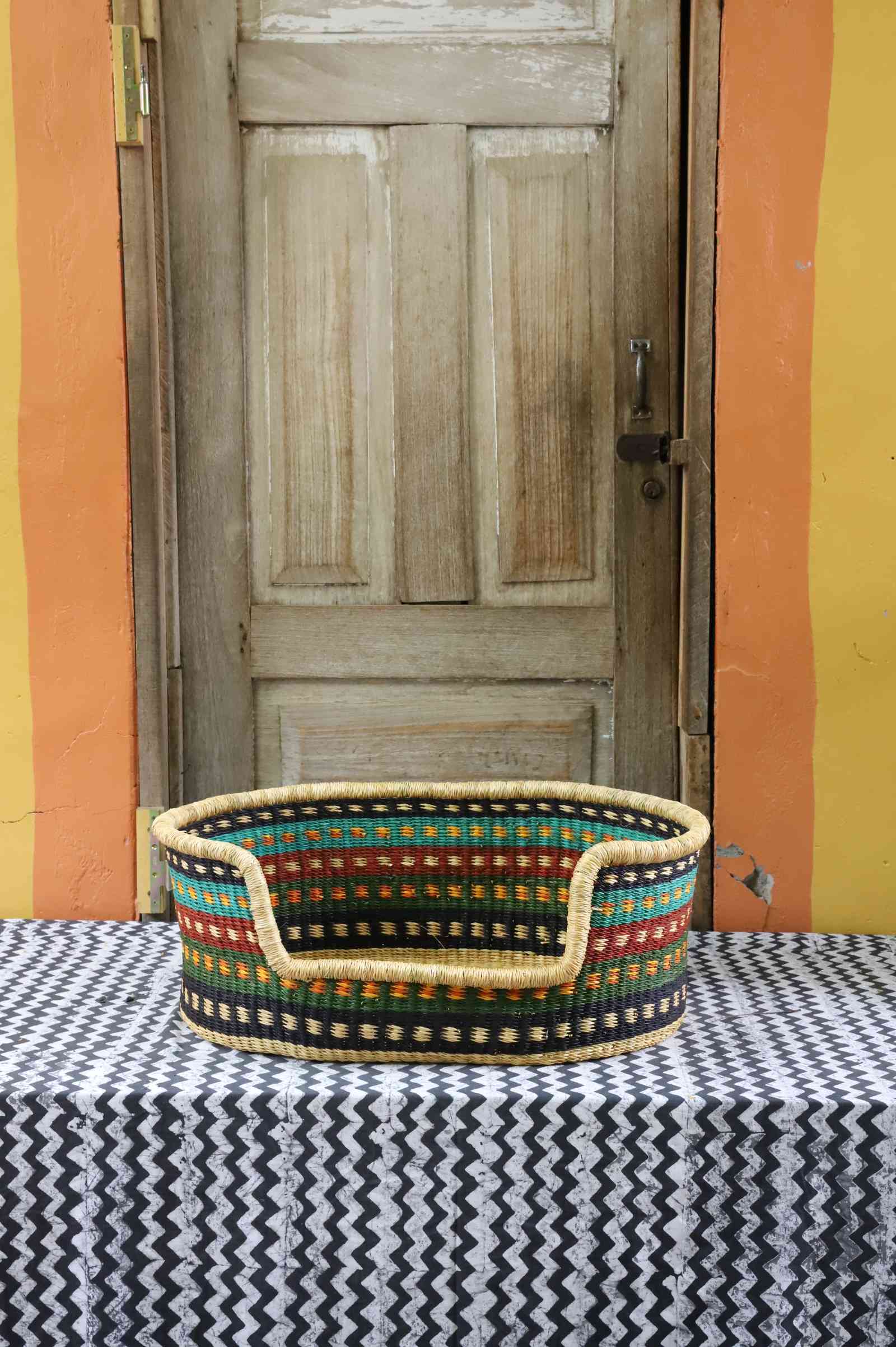 Small woven dog bed handwoven from elephant grass in Bolgatanga, Ghana.