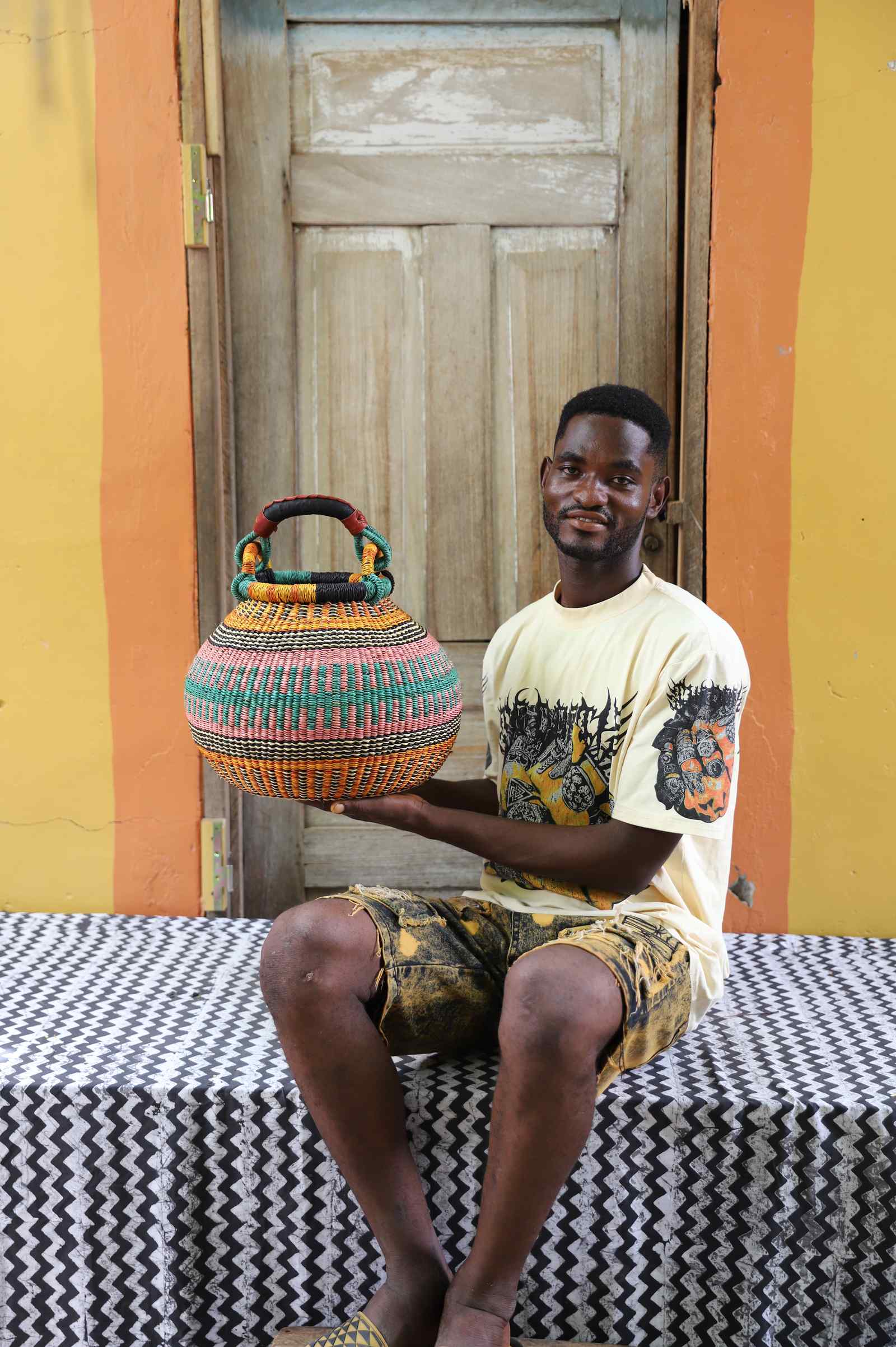 Handwoven African basket in elephant grass, a pot form for keepsakes and small objects.