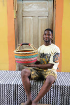 Handwoven African basket in elephant grass, round in form with a tight, strong weave.