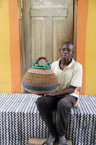 Handwoven African basket in elephant grass, 42 cm wide, shaped like a pot.