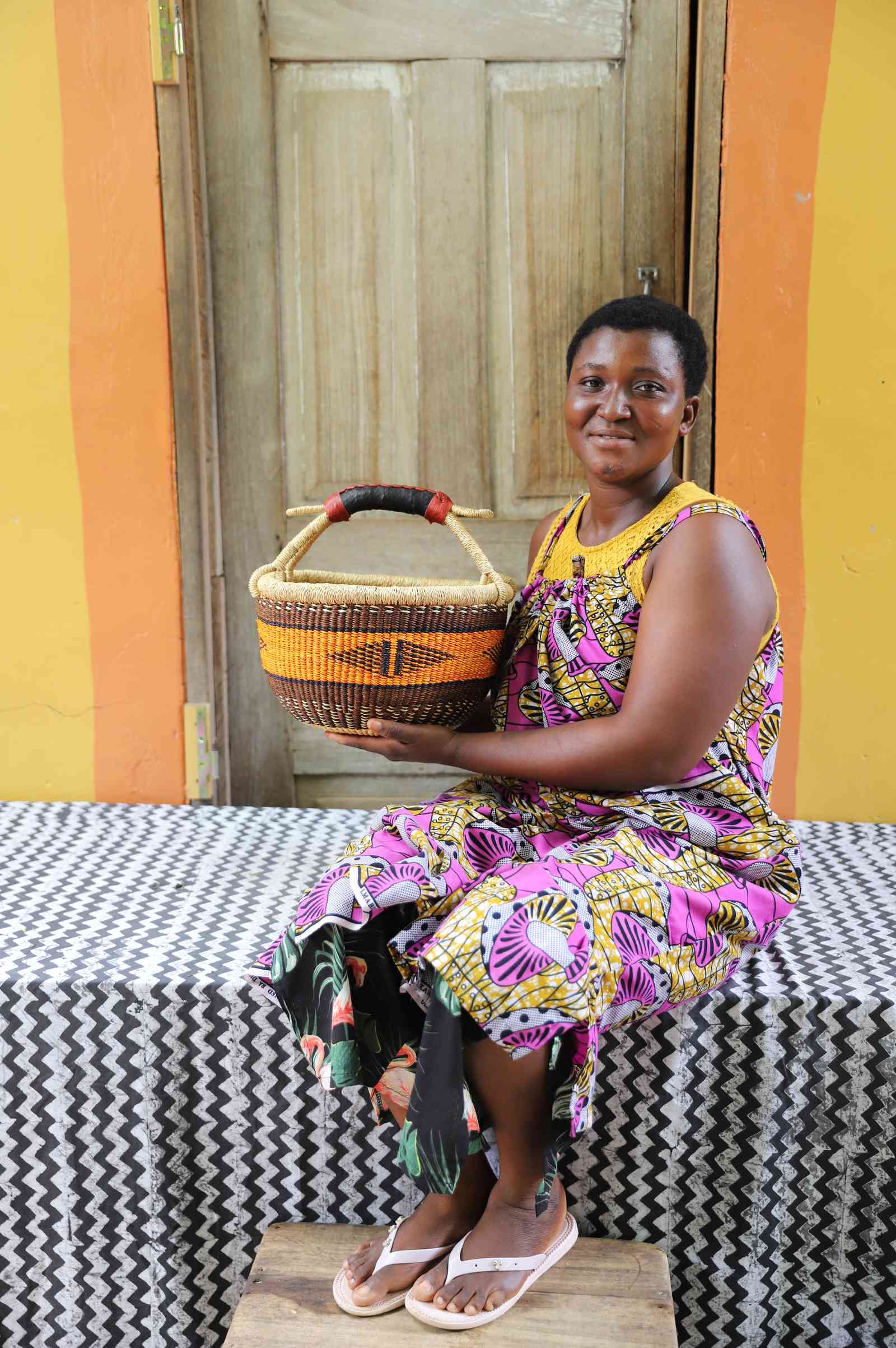 Small handwoven Bolga basket in elephant grass, the original round Bolgatanga form.