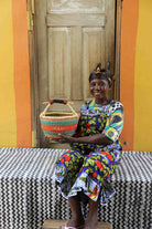 Small round Bolga basket in elephant grass, 30 cm wide, woven for real weight.