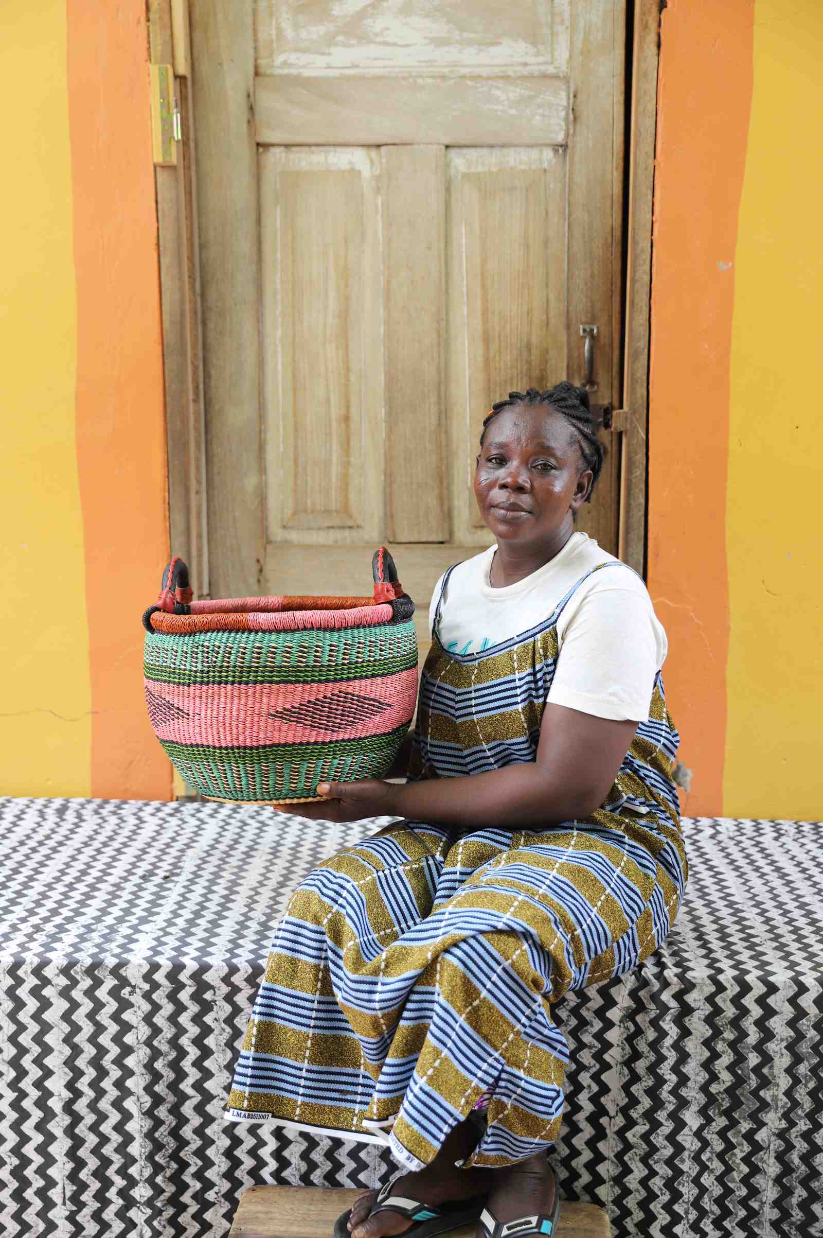 Handwoven Bolga basket in elephant grass, a sieve-derived form standing 28 cm tall.